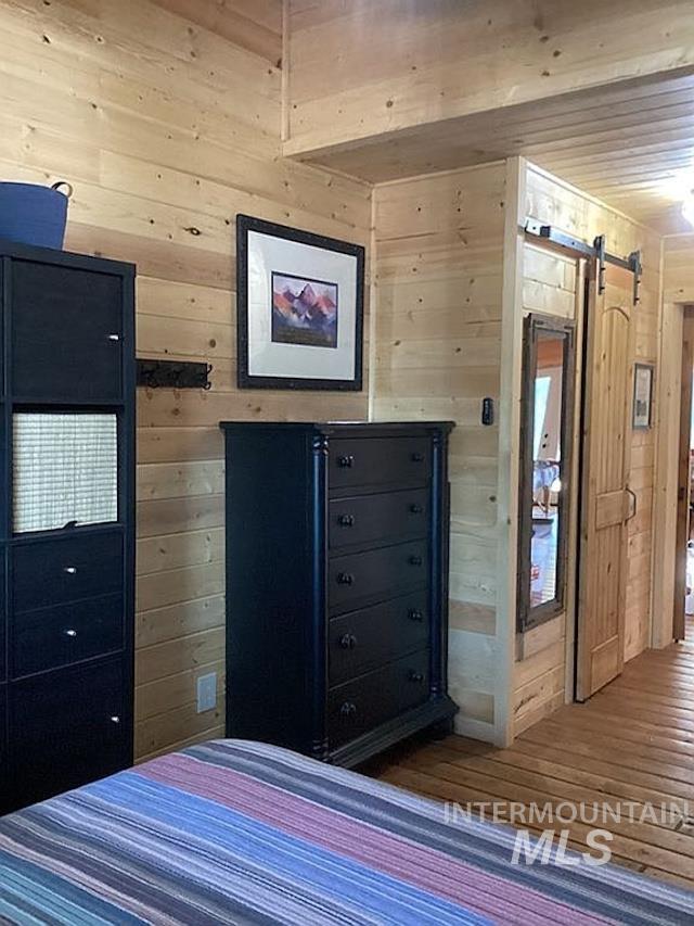 1000 Pardee Road Kamiah, ID 83536 - Photo 31 of 50 Horizontal wood plank walls and ceiling with a matching wood-finish flooring