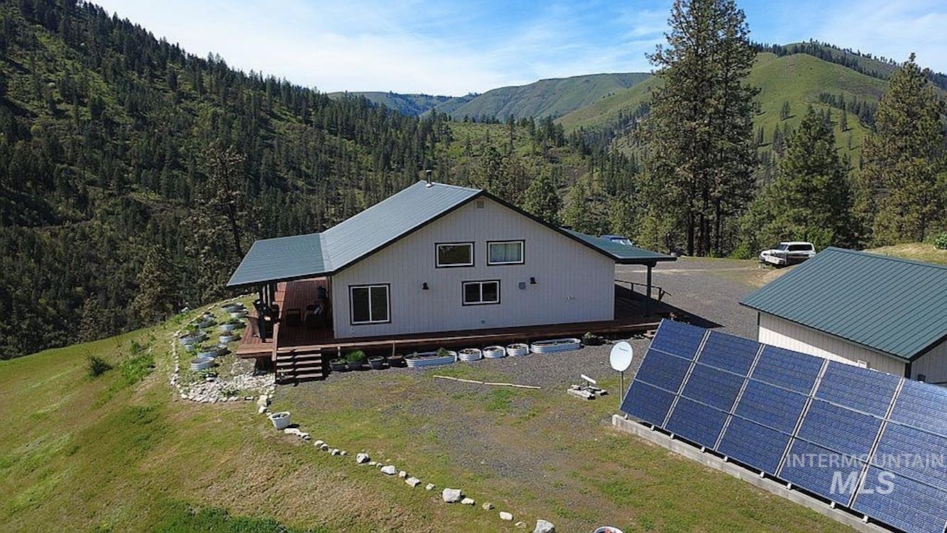 1000 Pardee Road Kamiah, ID 83536 - Photo 50 of 50 Hillside residence featuring a white exterior with dark trim and a green roof