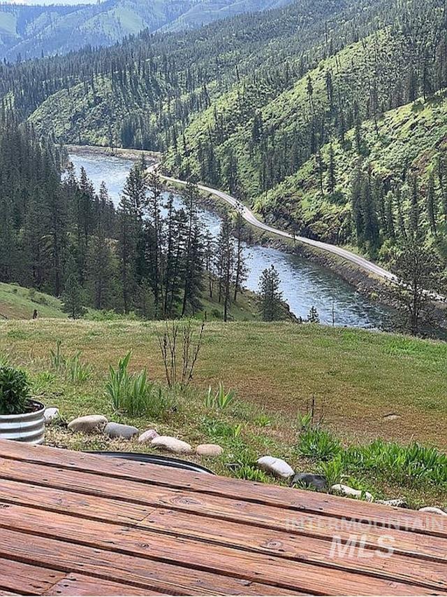 1000 Pardee Road Kamiah, ID 83536 - Photo 8 of 50 Expansive outdoor wood deck overlooking a natural river and forested hillsides