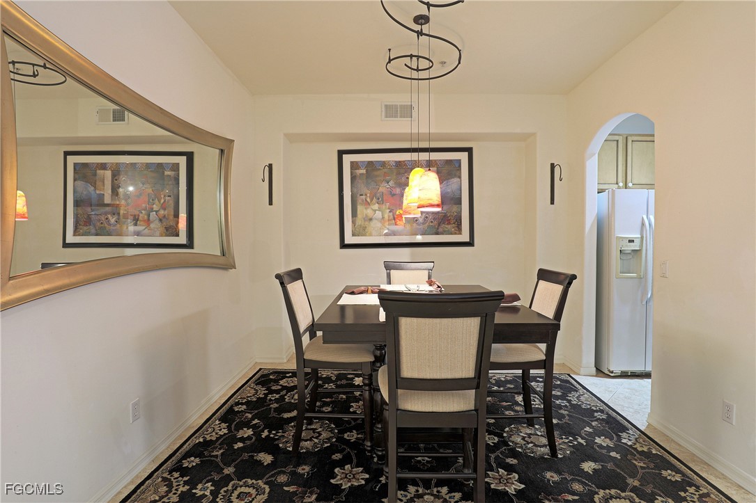 13225 Silver Thorn Loop, Unit 304 North Fort Myers, FL 33903 - Photo 11 of 27 a view of a dining room with furniture