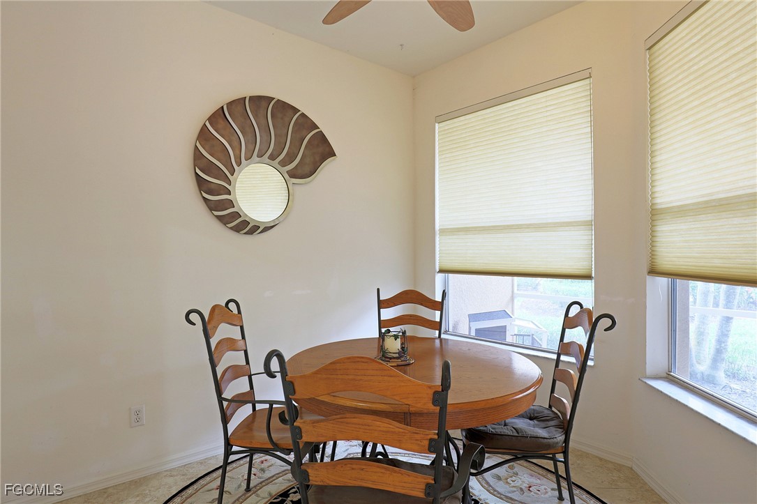 13225 Silver Thorn Loop, Unit 304 North Fort Myers, FL 33903 - Photo 12 of 27 a dining room with furniture and window