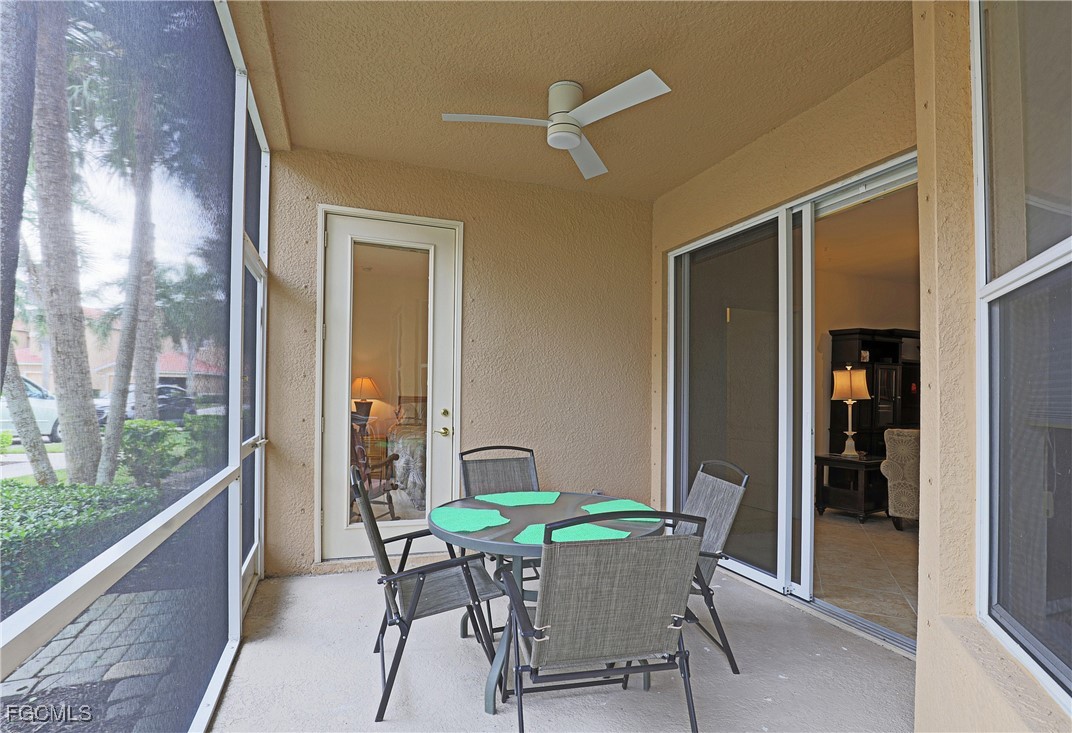 13225 Silver Thorn Loop, Unit 304 North Fort Myers, FL 33903 - Photo 21 of 27 a patio with table and chairs and potted plants