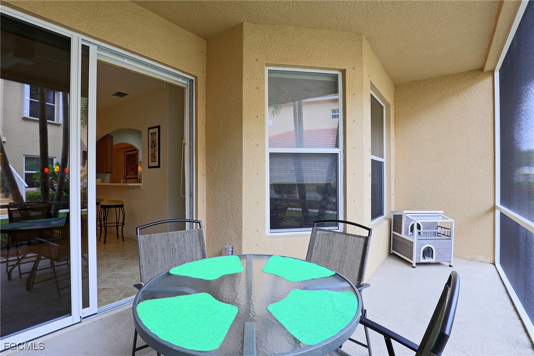 13225 Silver Thorn Loop, Unit 304 North Fort Myers, FL 33903 - Photo 24 of 27 a living room with furniture and a wooden floor