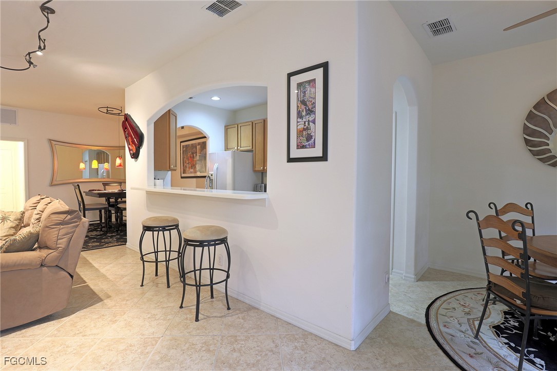 13225 Silver Thorn Loop, Unit 304 North Fort Myers, FL 33903 - Photo 6 of 27 a view of a livingroom with furniture and a chair