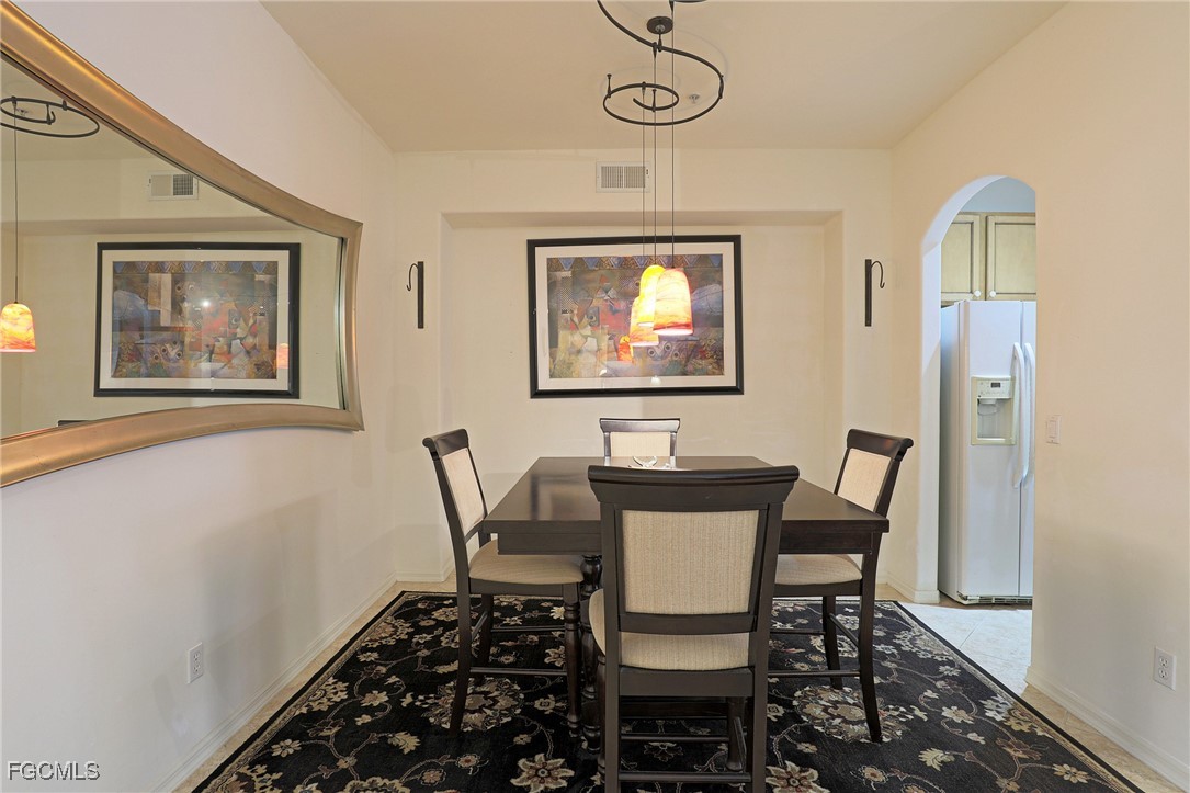 13225 Silver Thorn Loop, Unit 304 North Fort Myers, FL 33903 - Photo 10 of 27 a view of a dining room with furniture