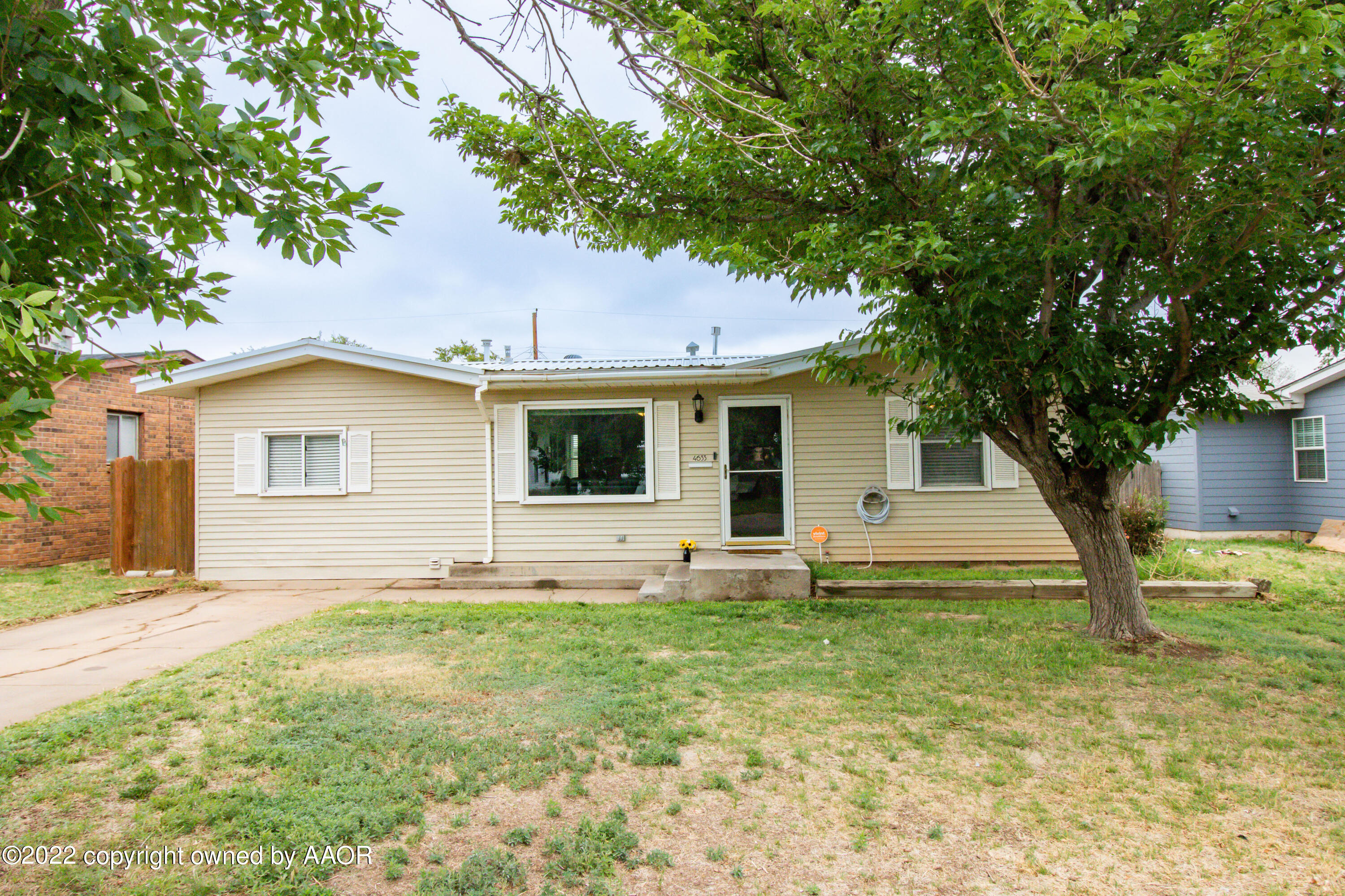 4633 South Hayden Street Amarillo, TX 79110 - Photo 1 of 20 a view of a house with a yard