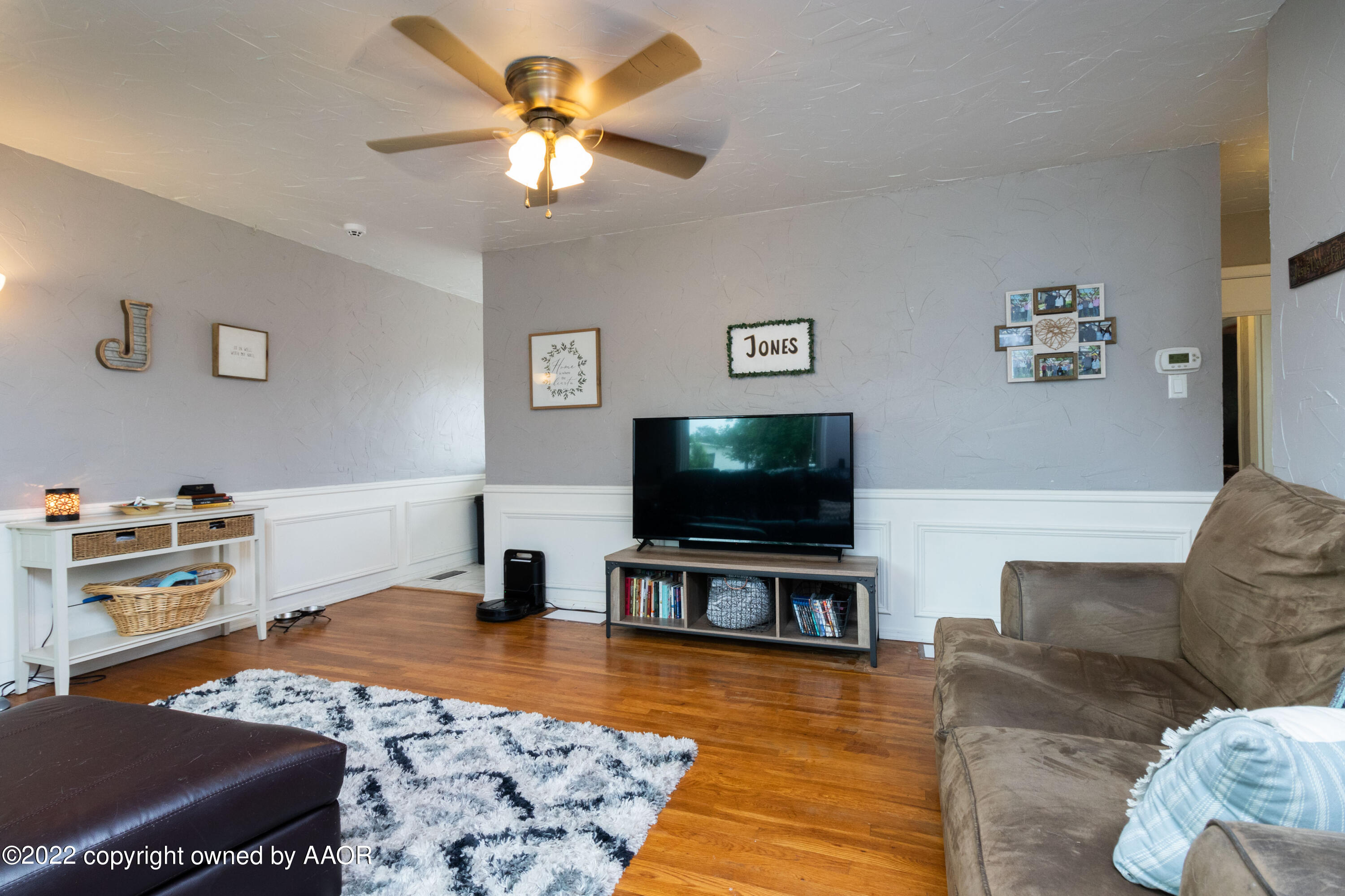 4633 South Hayden Street Amarillo, TX 79110 - Photo 5 of 20 a living room with furniture and a flat screen tv