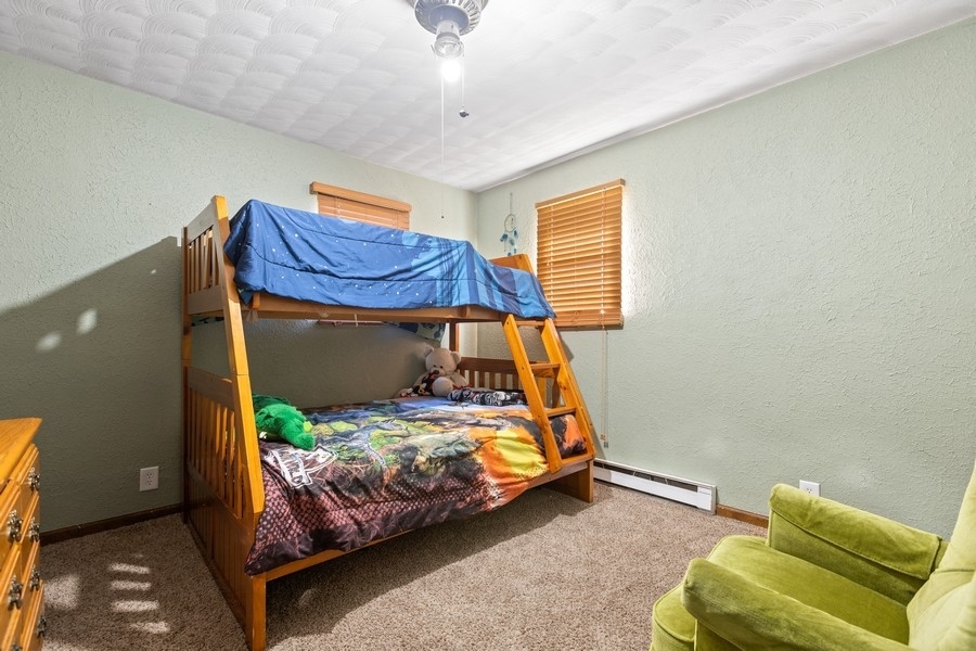 19948 West Mississippi Road Elwood, IL 60421 - Photo 7 of 12 a bedroom with a bed and a window
