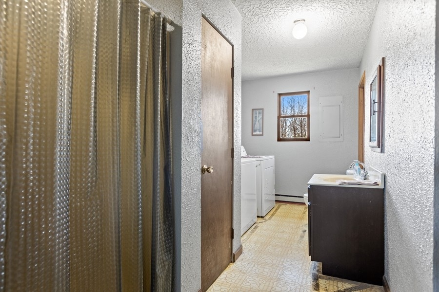 19948 West Mississippi Road Elwood, IL 60421 - Photo 10 of 12 a view of a hallway with bathroom and mirror