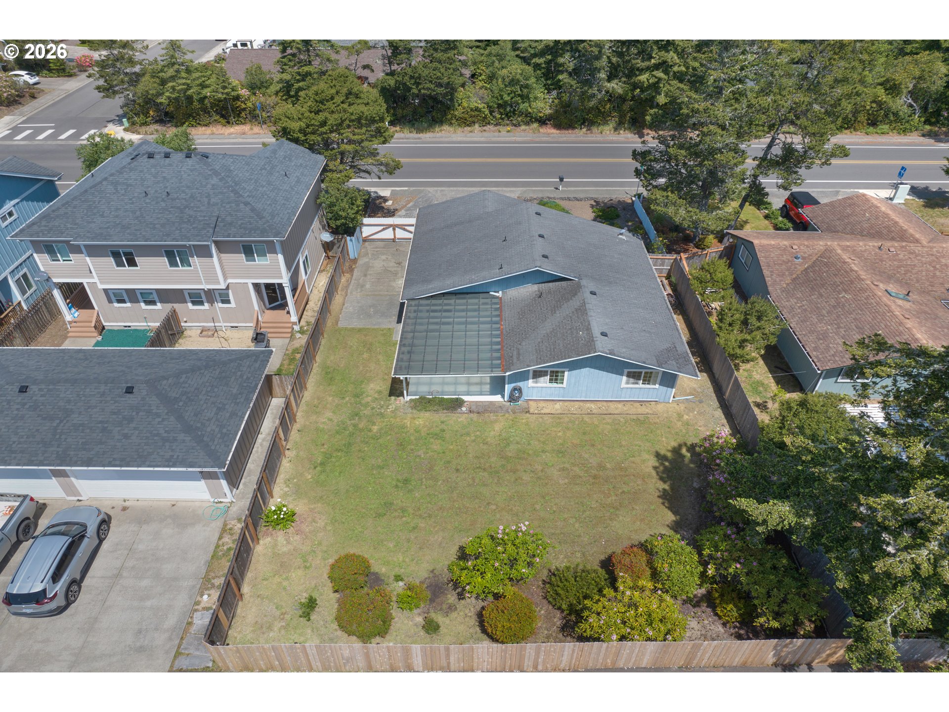 1142 9th Street Florence, OR 97439 - Photo 37 of 41 a view of residential houses with outdoor space and swimming pool