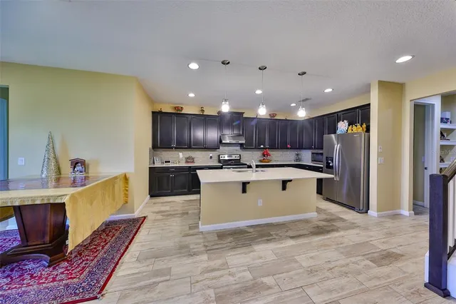 a kitchen with counter top space cabinets and stainless steel appliances