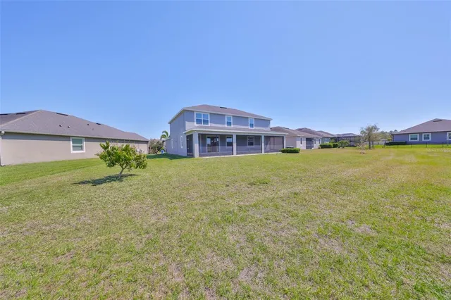 an aerial view of a house with a ocean view
