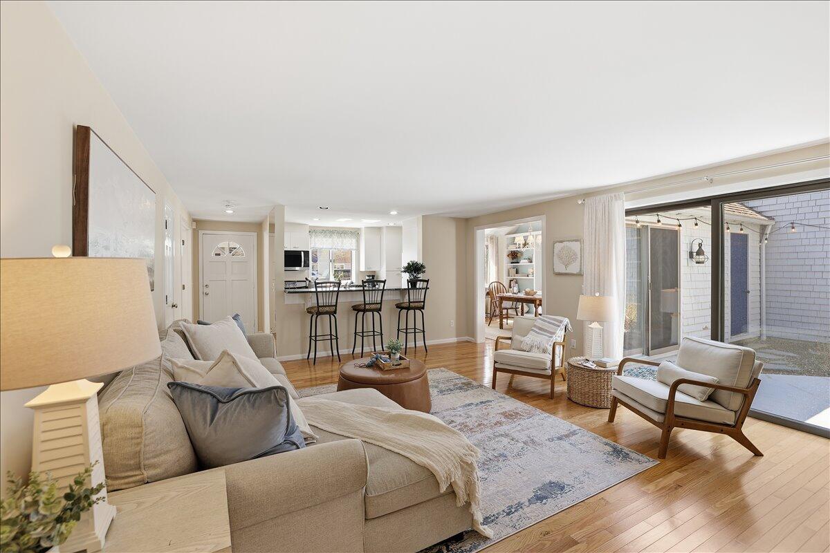 100 Mid-Iron Way, Unit 7027 Mashpee, MA 02649 - Photo 1 of 38 a living room with furniture and a table