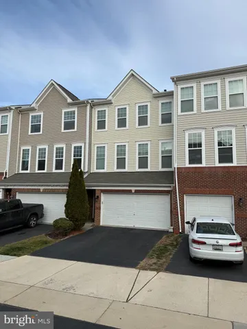 a front view of a house with parking space