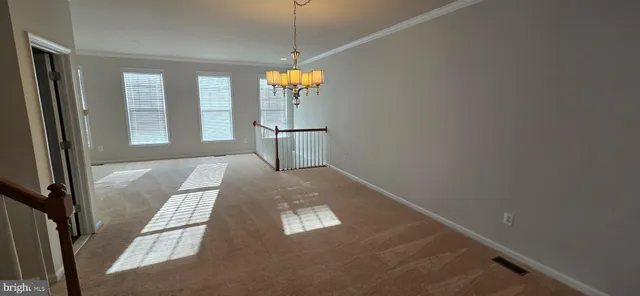 an empty room with windows and outdoor view