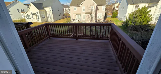 a view of balcony with wooden floor