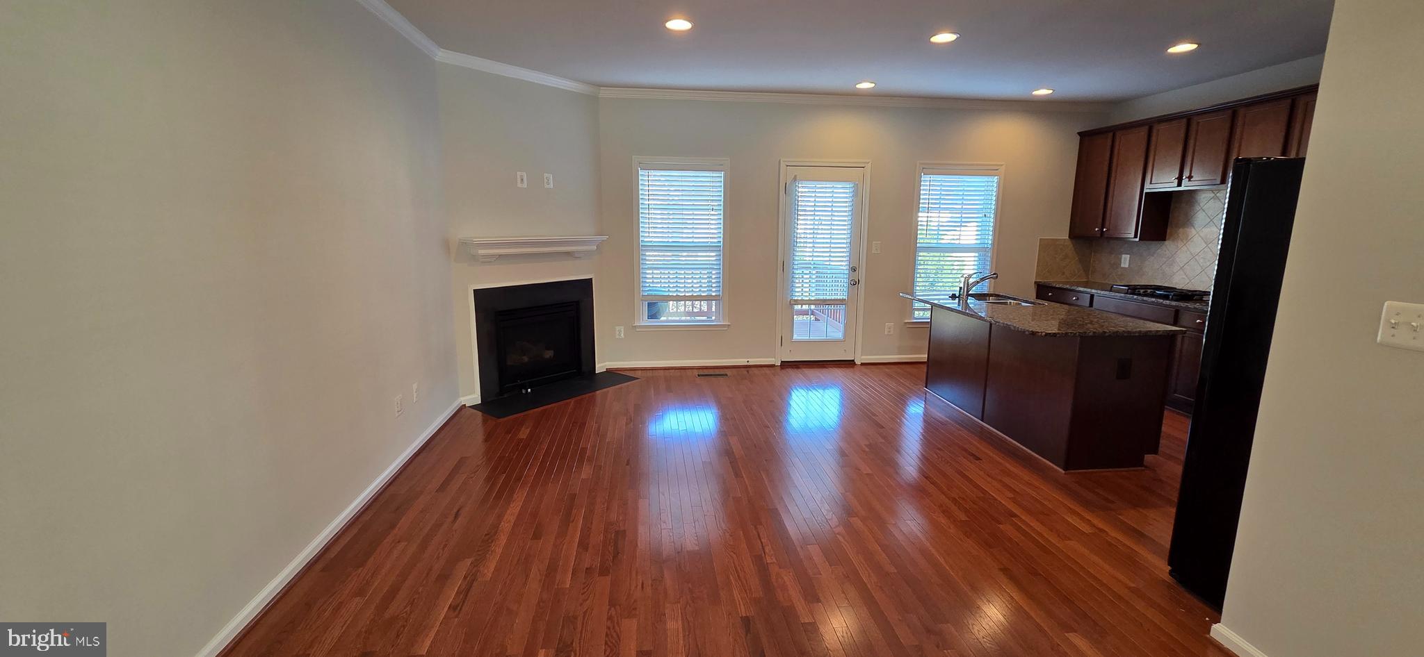 41836 Diabase Square Aldie, VA 20105 - Photo 4 of 29 a view of empty room with wooden floor and fireplace