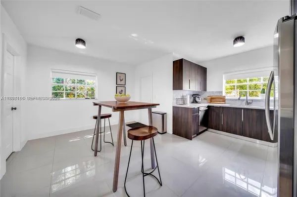 a kitchen with sink cabinets and window