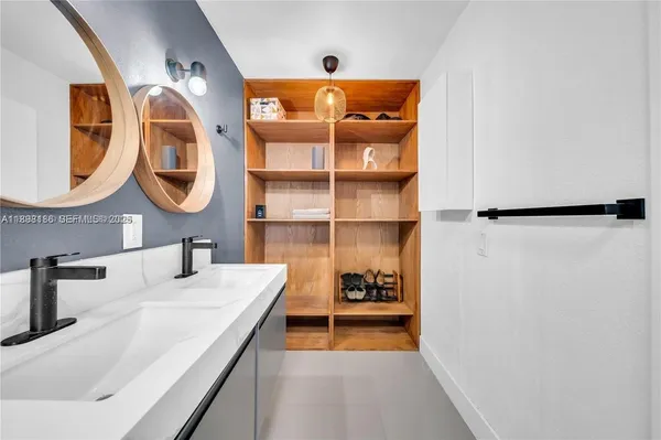 a bathroom with a sink and a mirror