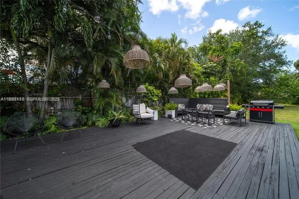 a outdoor living space with furniture and a potted plant
