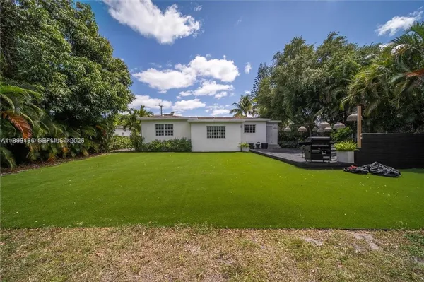 a front view of house with yard outdoor seating and entertaining space