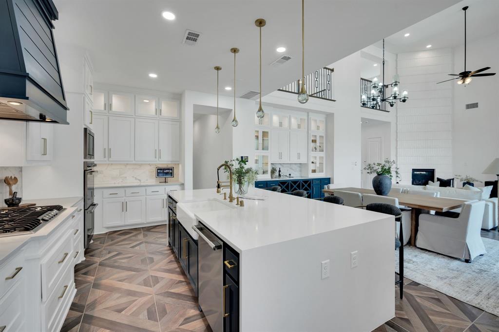 1516 M3 Ranch Road Mansfield, TX 76063 - Photo 17 of 40 The gold accents, hardware and custom lighting over island- are designer touches!