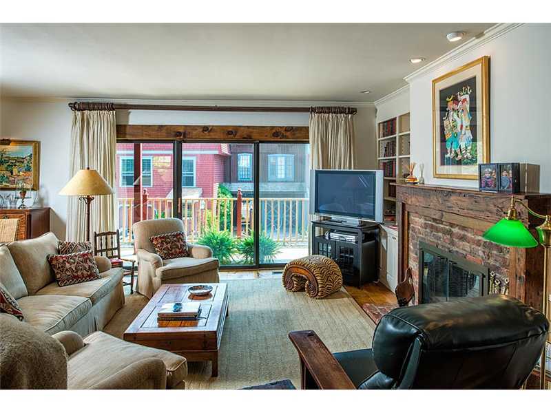 603 Steamboat Road, Unit 2 Greenwich, CT 06830 - Photo 2 of 10 a living room with furniture and a floor to ceiling window