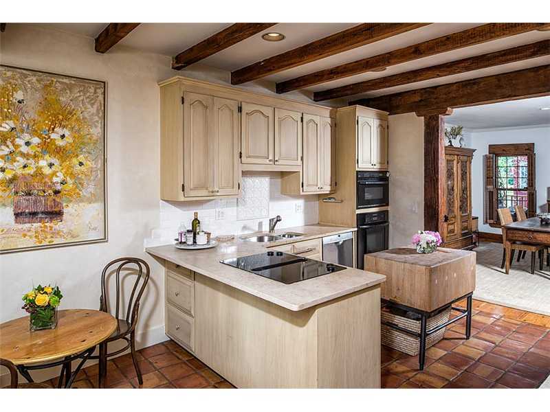 603 Steamboat Road, Unit 2 Greenwich, CT 06830 - Photo 5 of 10 a kitchen with a dining table chairs and refrigerator