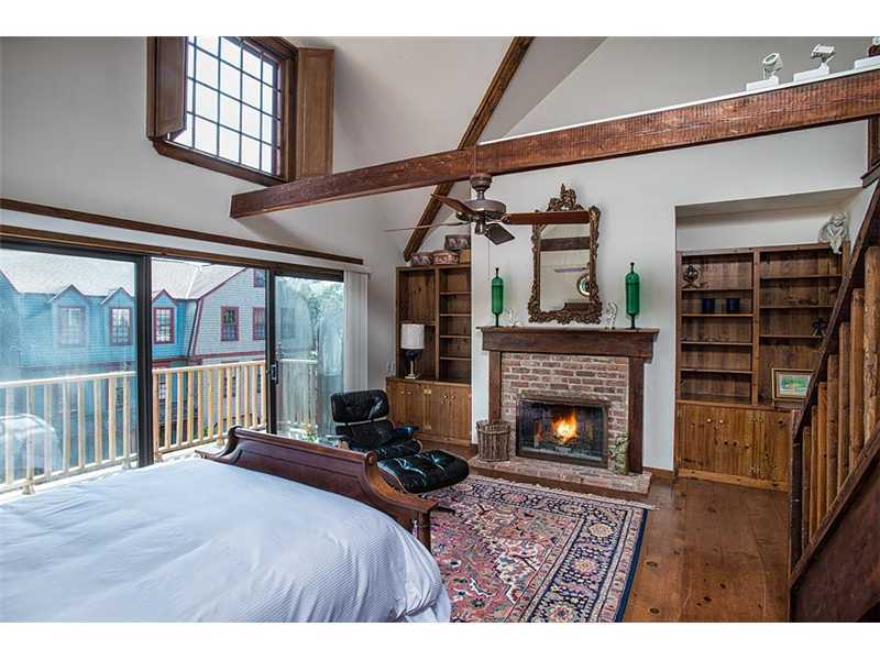 603 Steamboat Road, Unit 2 Greenwich, CT 06830 - Photo 6 of 10 a bedroom with furniture fireplace and window