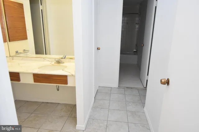 a bathroom with a bathtub and a sink