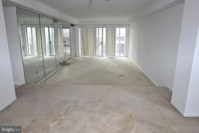 an empty room with windows