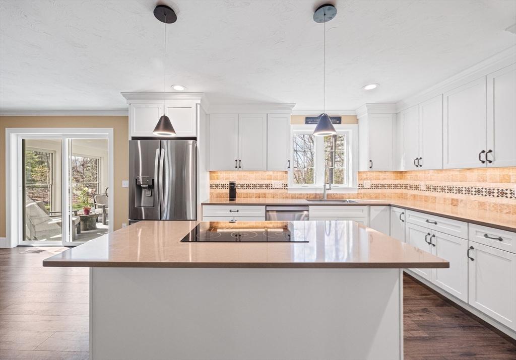 52 Great Neck Road Wareham, MA 02538 - Photo 16 of 42 a kitchen with stainless steel appliances granite countertop a refrigerator and a sink