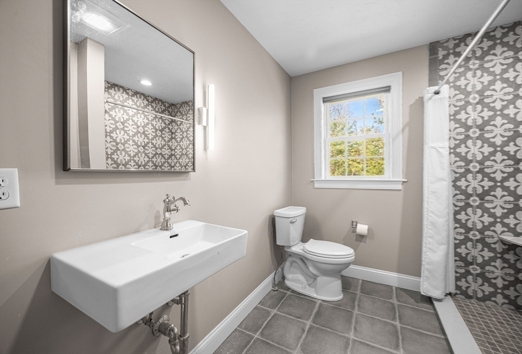 52 Great Neck Road Wareham, MA 02538 - Photo 23 of 42 a bathroom with a sink toilet and a mirror