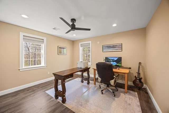 a bedroom with furniture and a flat screen tv