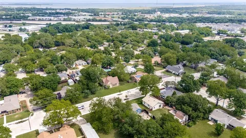 an aerial view of a city with lots of residential buildings