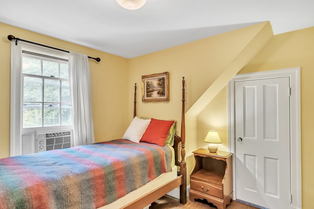 3 White Road Wayland, MA 01778 - Photo 13 of 19 a bedroom with a bed and wooden floor