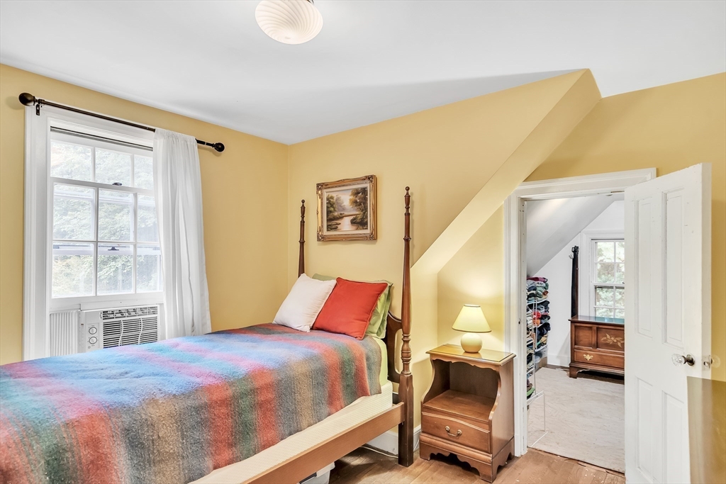 3 White Road Wayland, MA 01778 - Photo 14 of 19 a bedroom with a bed and wooden floor