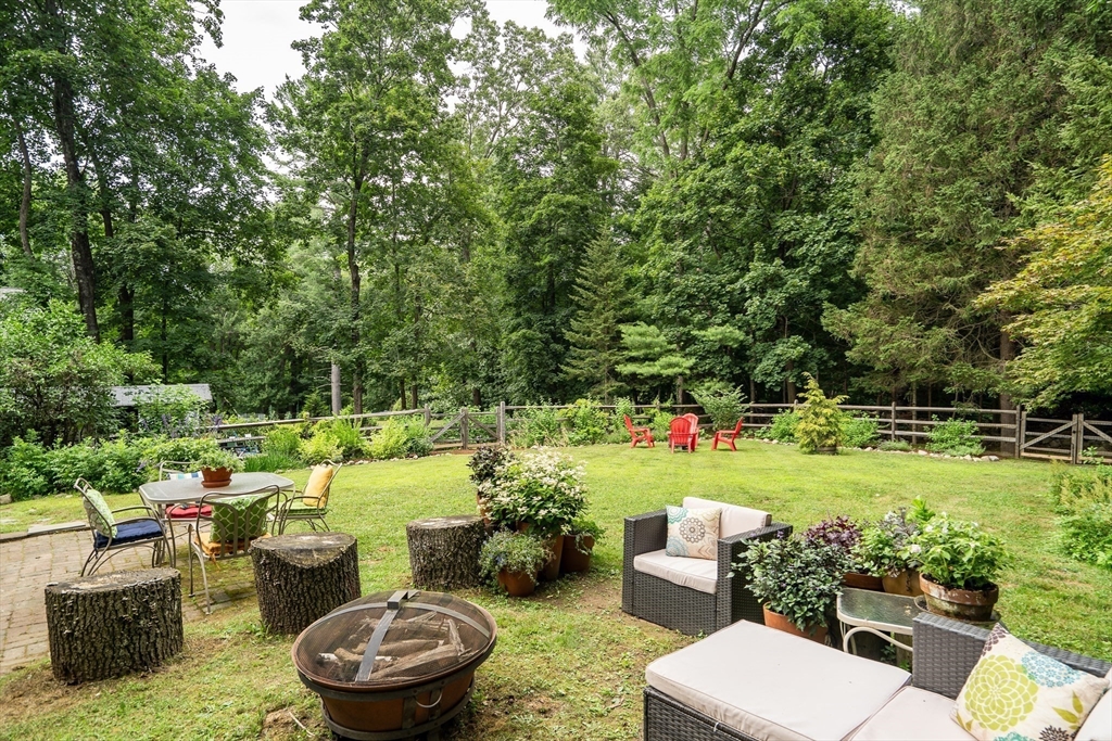 3 White Road Wayland, MA 01778 - Photo 19 of 19 a view of a backyard with plants and a garden