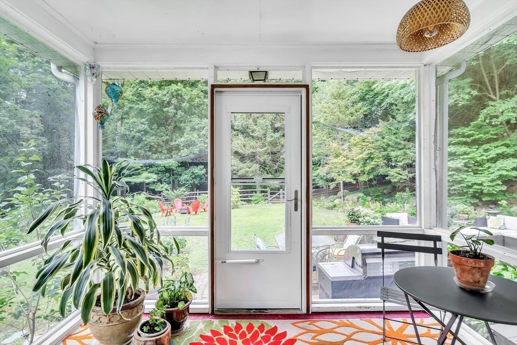 3 White Road Wayland, MA 01778 - Photo 9 of 19 a living room with a large window and dining table