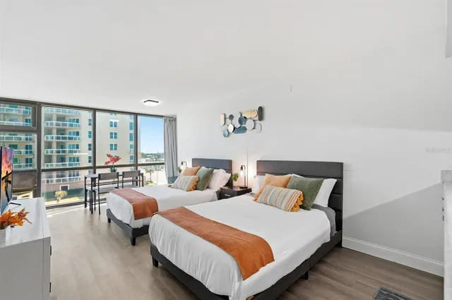 a bedroom with bed and window