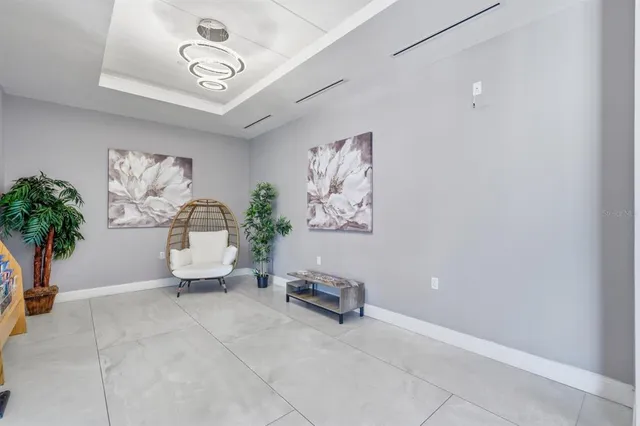 a bathroom with a granite countertop bathtub shower sink vanity and toilet