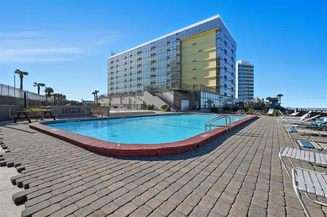 a view of a swimming pool and outdoor space