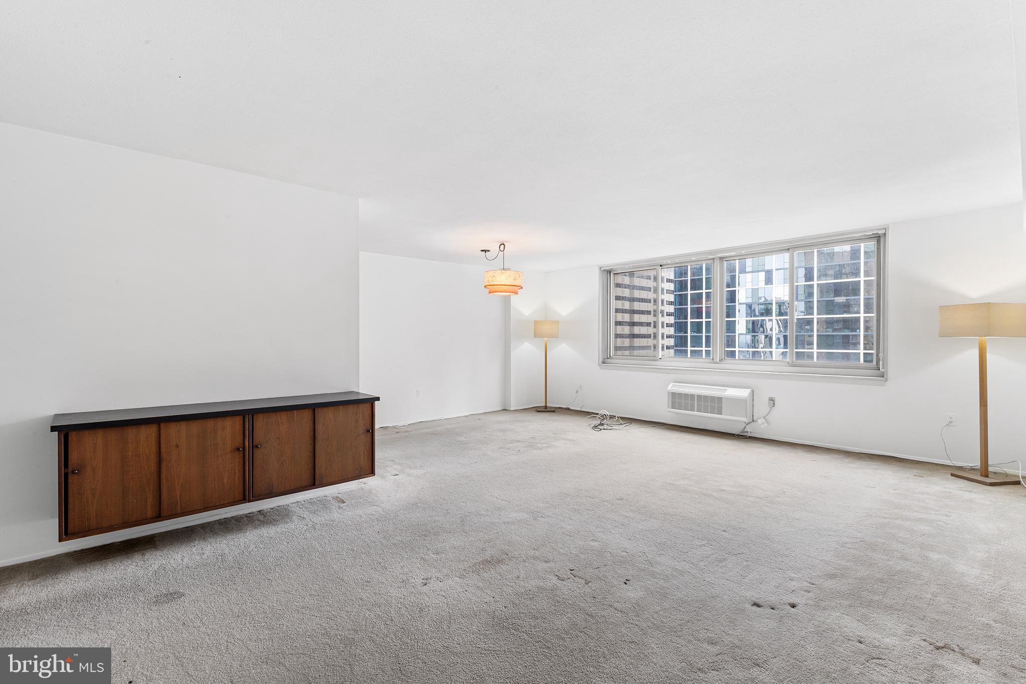 1919 Chestnut Street, Unit 202324 Philadelphia, PA 19103 - Photo 15 of 38 a view of an empty room with a window