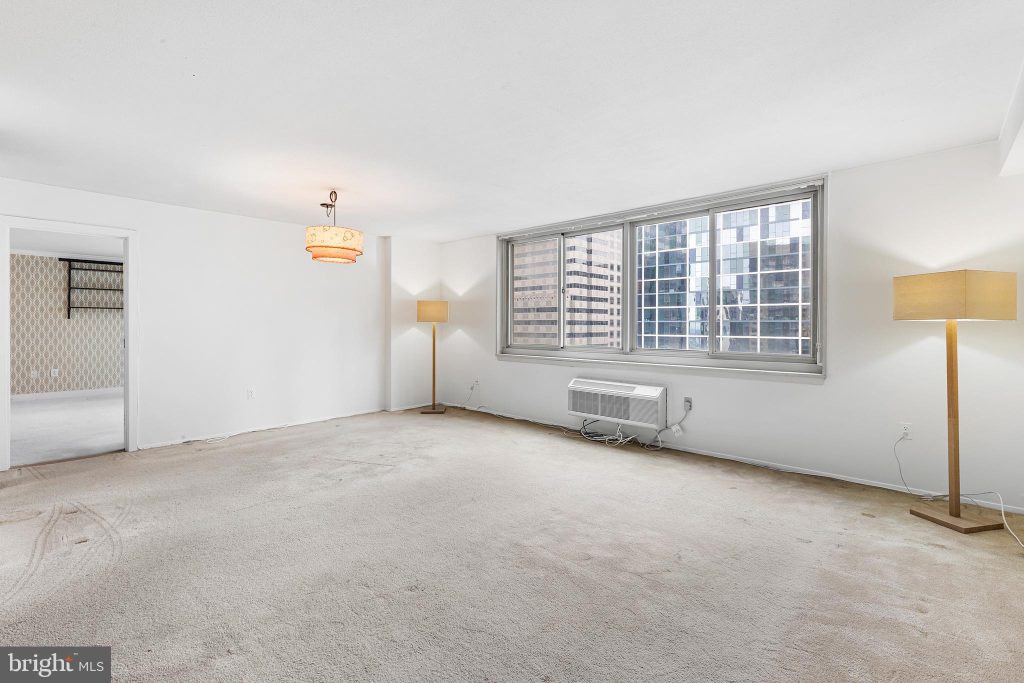1919 Chestnut Street, Unit 202324 Philadelphia, PA 19103 - Photo 16 of 38 an empty room with windows