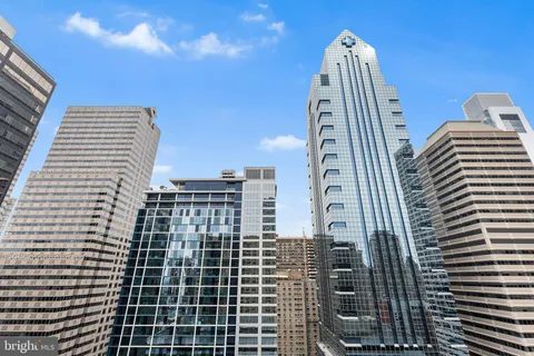 a kitchen with stainless steel appliances a sink stove and cabinets