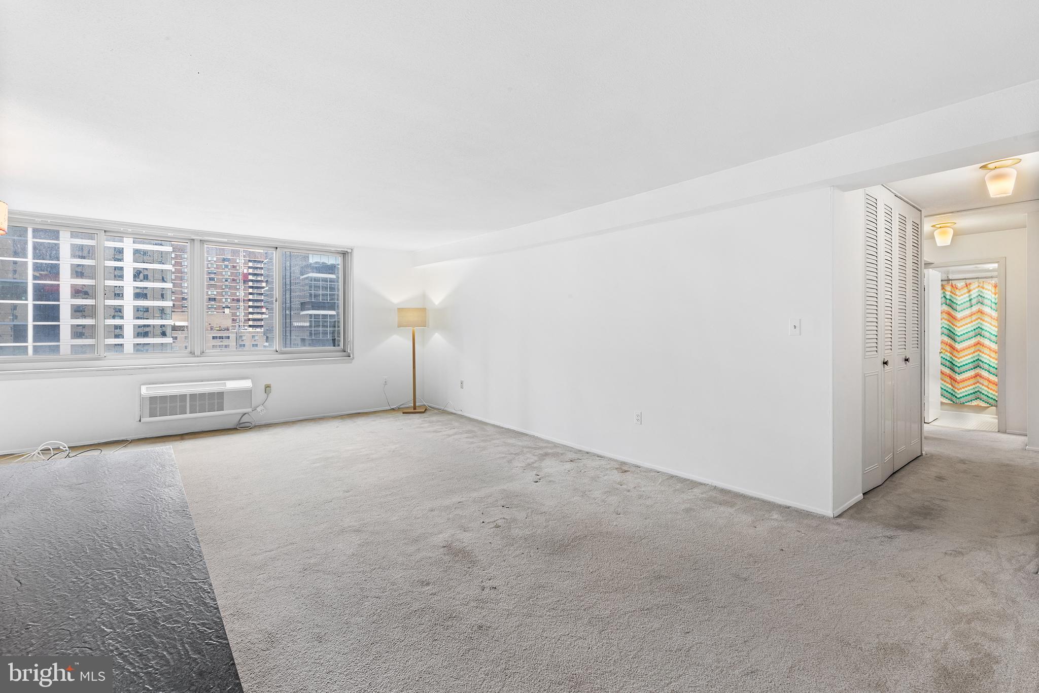 1919 Chestnut Street, Unit 202324 Philadelphia, PA 19103 - Photo 18 of 38 an empty room with windows