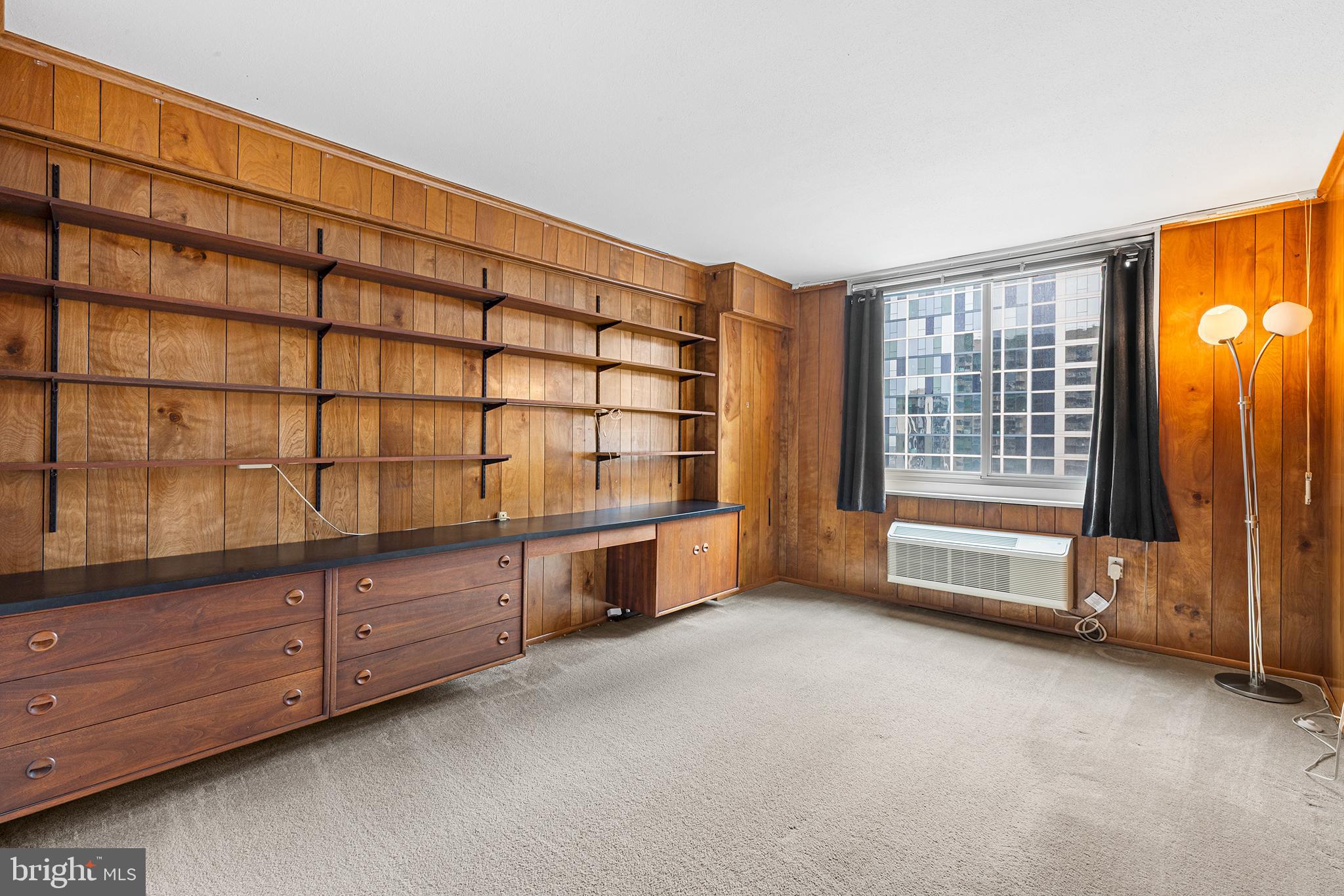 1919 Chestnut Street, Unit 202324 Philadelphia, PA 19103 - Photo 22 of 38 a view of an empty room with cabinet and mirrors