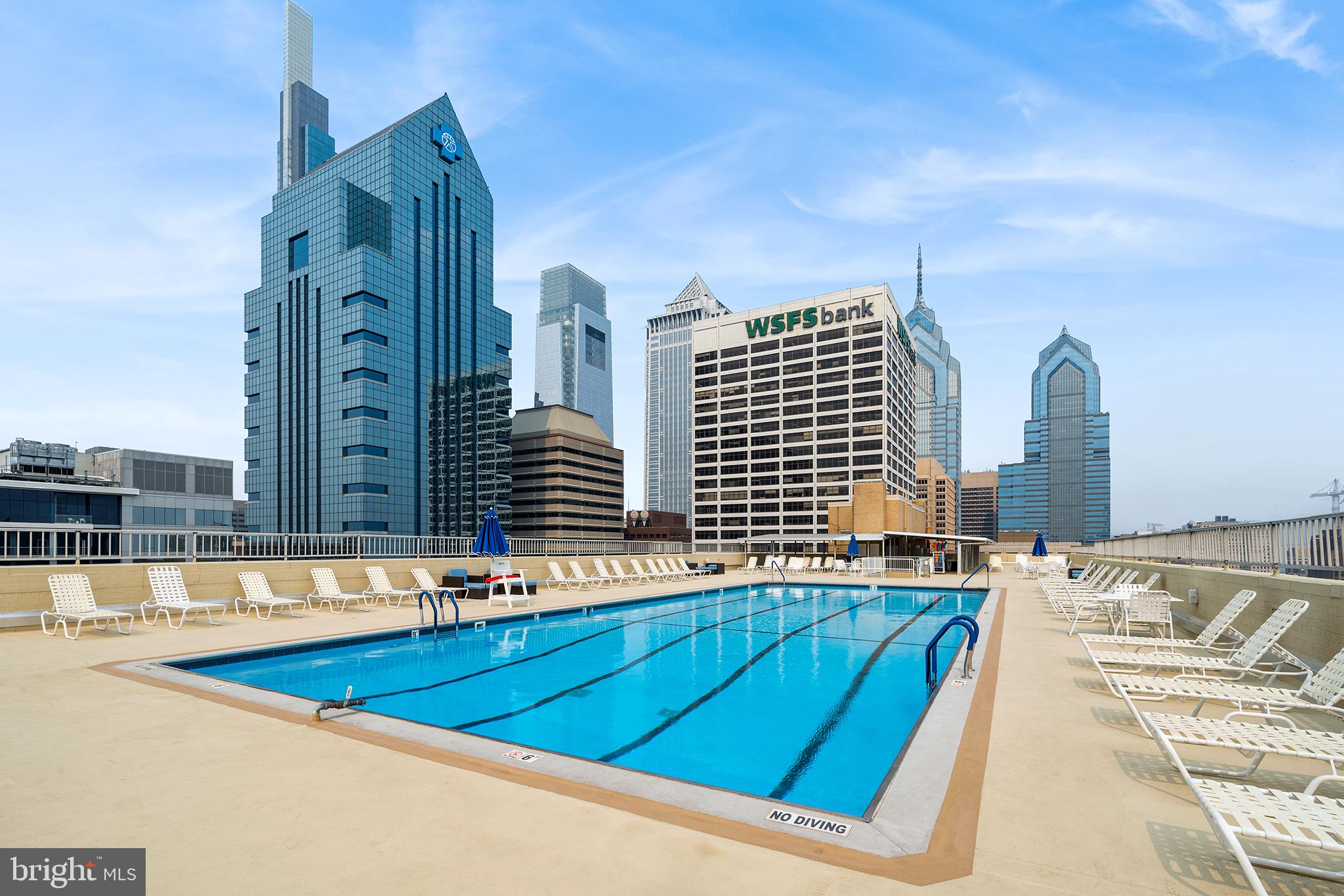 1919 Chestnut Street, Unit 202324 Philadelphia, PA 19103 - Photo 29 of 38 a view of swimming pool with outdoor seating and city view