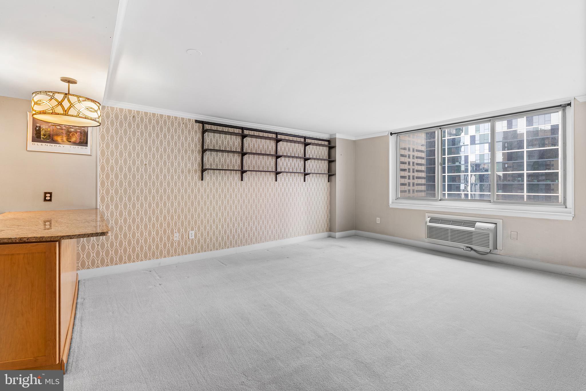 1919 Chestnut Street, Unit 202324 Philadelphia, PA 19103 - Photo 9 of 38 a view of an empty room with a window