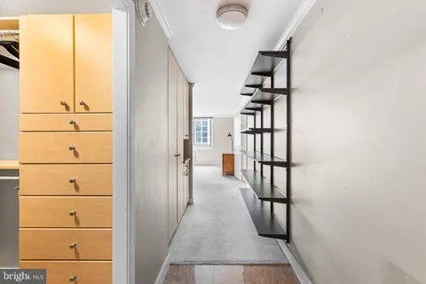 a bathroom with a glass door shower and a toilet